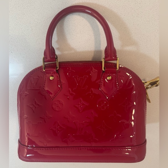 Louis Vuitton Handbags - Louis Vuitton "Alma" Monogram pat-tent Leather Medium Size Bag in Red. Looks new